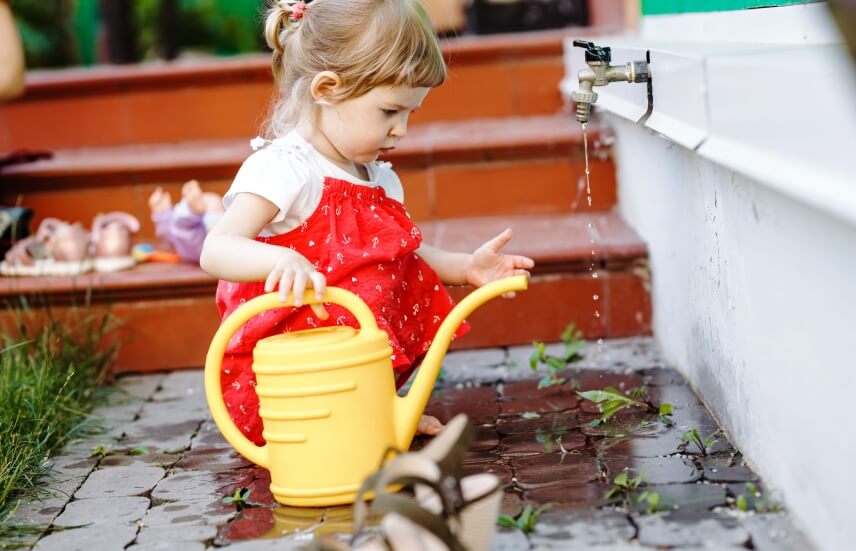 watering can and kid