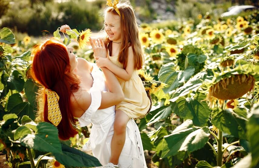 family-in-a-field-with-sunflower